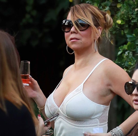 Mariah Carey looks glamorous in plunging white dress  | mcarchives.com