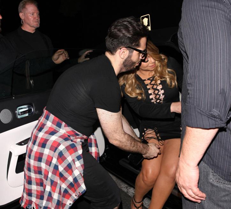 Mariah Carey is helped into her car | mcarchives.com