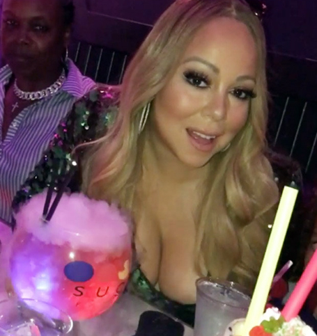 Braless Mariah's cleavage explodes from plunging dress | mcarchives.com