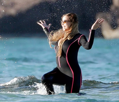 Mariah Carey makes a splash in a busty wetsuit | mcarchives.com