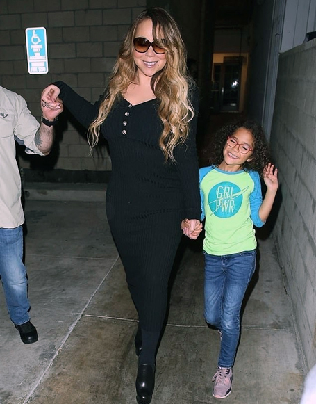 Mariah Carey holds daughter Monroe's hand  | mcarchives.com