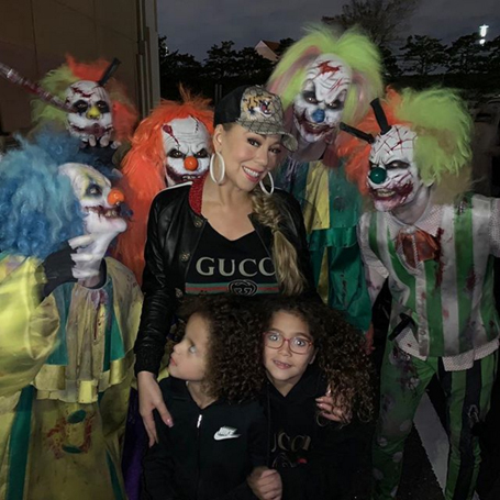 Mariah Carey surrounded by creepy clowns | mcarchives.com