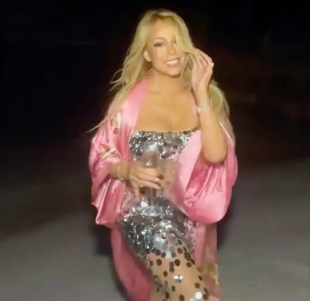 Mariah celebrates 56th birthday in silver sequined dress | mcarchives.com