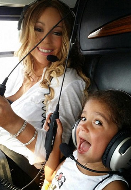 Mariah Carey enjoys a helicopter ride with Monroe | mcarchives.com
