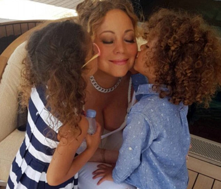 Mariah Carey goes braless in a lace-up top | mcarchives.com